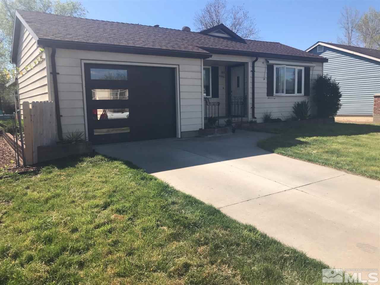 1205 Wilkinson Avenue Reno, NV 89502 - Photo 2 of 17 a front view of a house with a yard