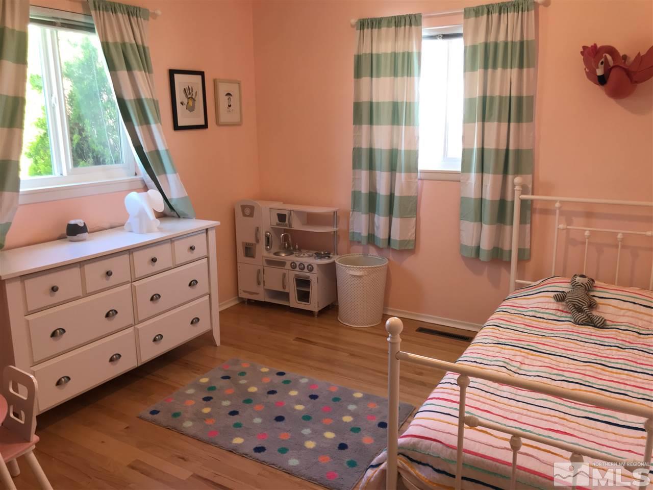 1205 Wilkinson Avenue Reno, NV 89502 - Photo 9 of 17 a bedroom with furniture and a window