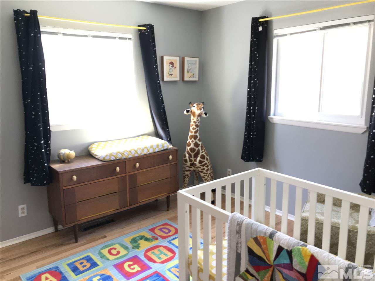 1205 Wilkinson Avenue Reno, NV 89502 - Photo 10 of 17 a bedroom with furniture and a window