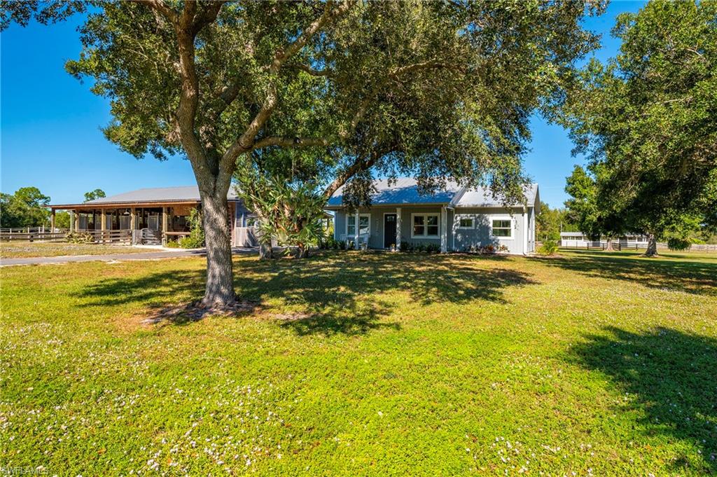 10910 Ruden Road North Fort Myers, FL 33917 - Photo 16 of 48 a front view of a building with a lake view
