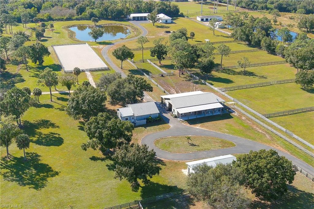 10910 Ruden Road North Fort Myers, FL 33917 - Photo 2 of 48 an aerial view of residential house with swimming pool