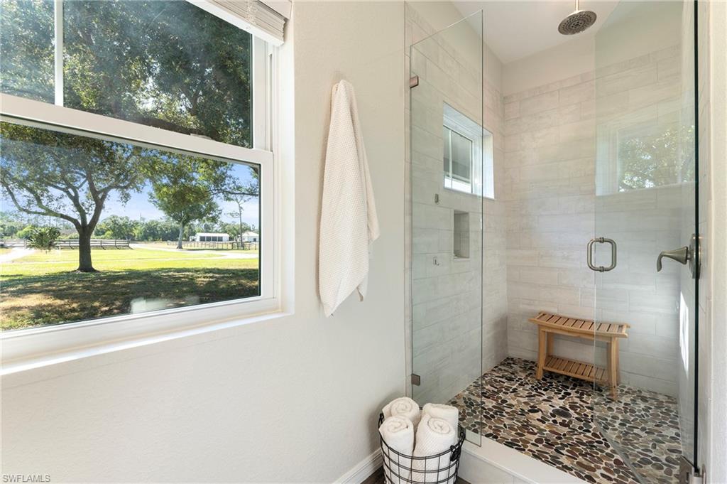 10910 Ruden Road North Fort Myers, FL 33917 - Photo 21 of 48 a bathroom with a toilet and a shower