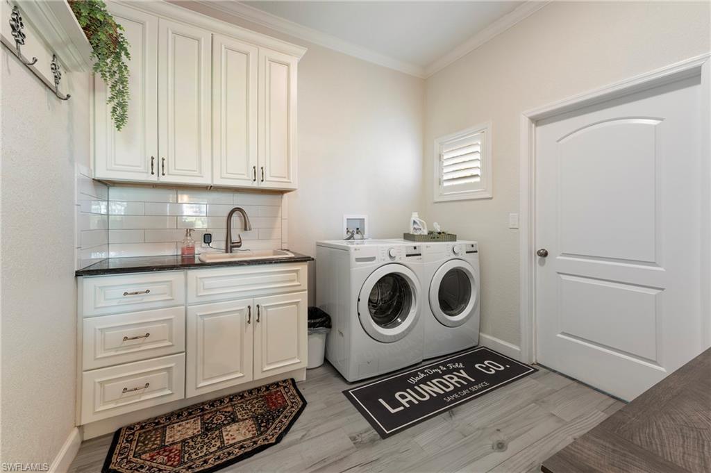 10910 Ruden Road North Fort Myers, FL 33917 - Photo 23 of 48 a utility room with sink dryer and washer