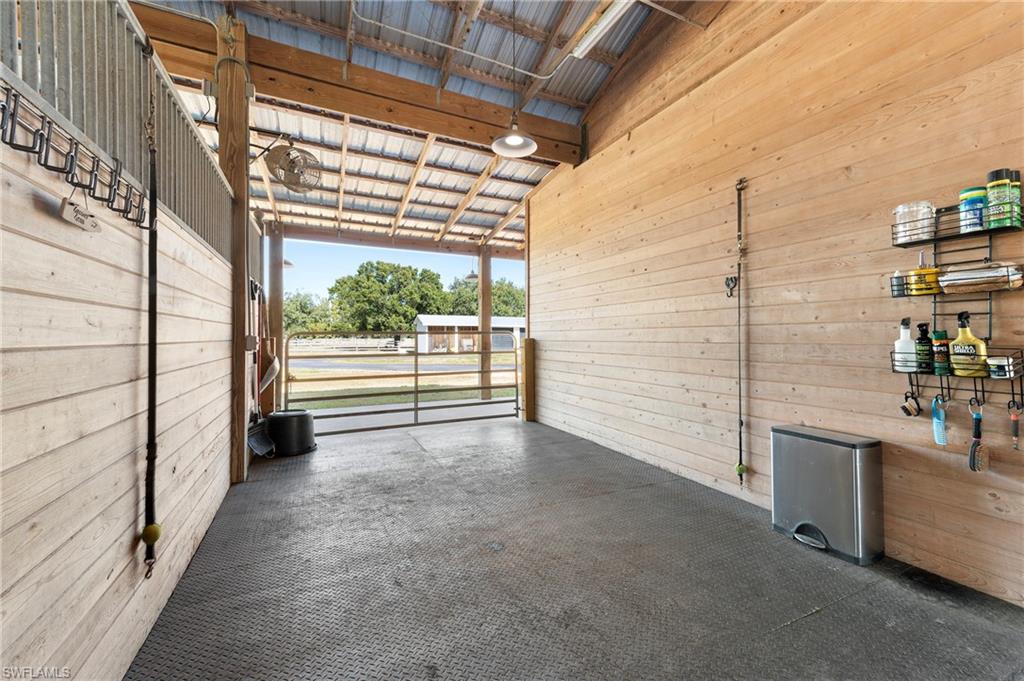 10910 Ruden Road North Fort Myers, FL 33917 - Photo 29 of 48 a view of a porch with wooden floor and iron fence
