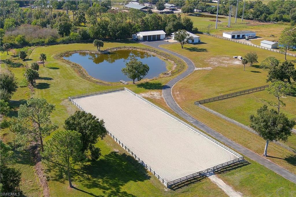 10910 Ruden Road North Fort Myers, FL 33917 - Photo 8 of 48 a view of a swimming pool with a yard