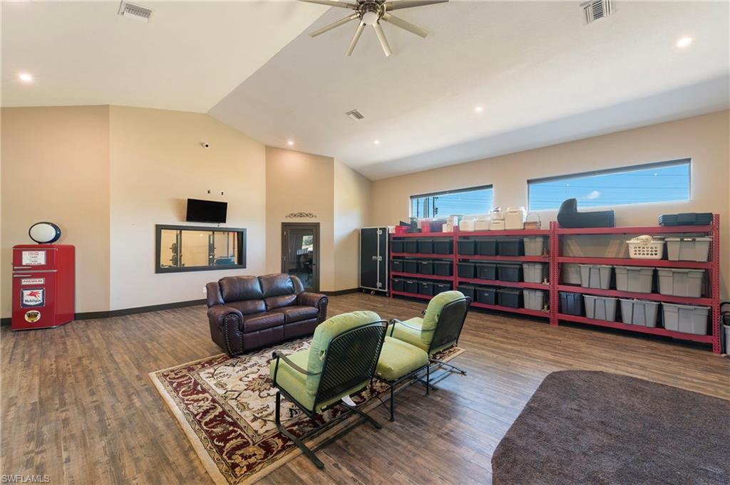 10910 Ruden Road North Fort Myers, FL 33917 - Photo 10 of 48 a living room with furniture a ceiling fan and a rug