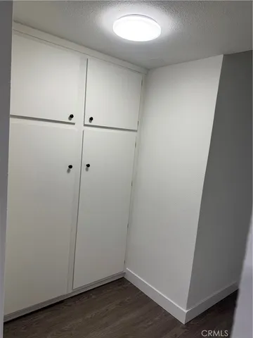 an empty room with wooden floor