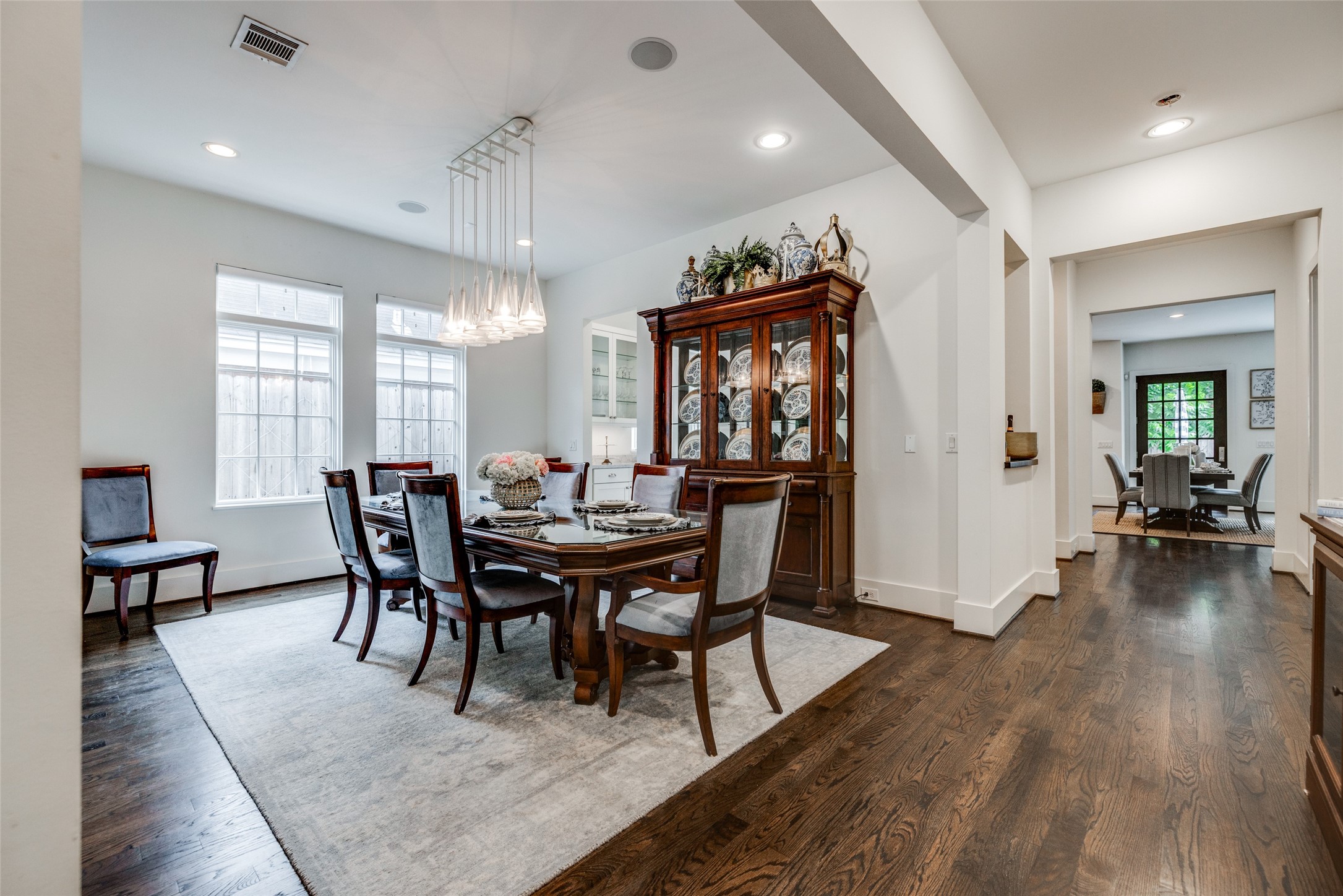 2815 Albans Road Houston, TX 77005 - Photo 9 of 50 Gorgeous large Dining Room to the front of the home with hardwood floors & beautiful chandelier, doors through to study & kitchen