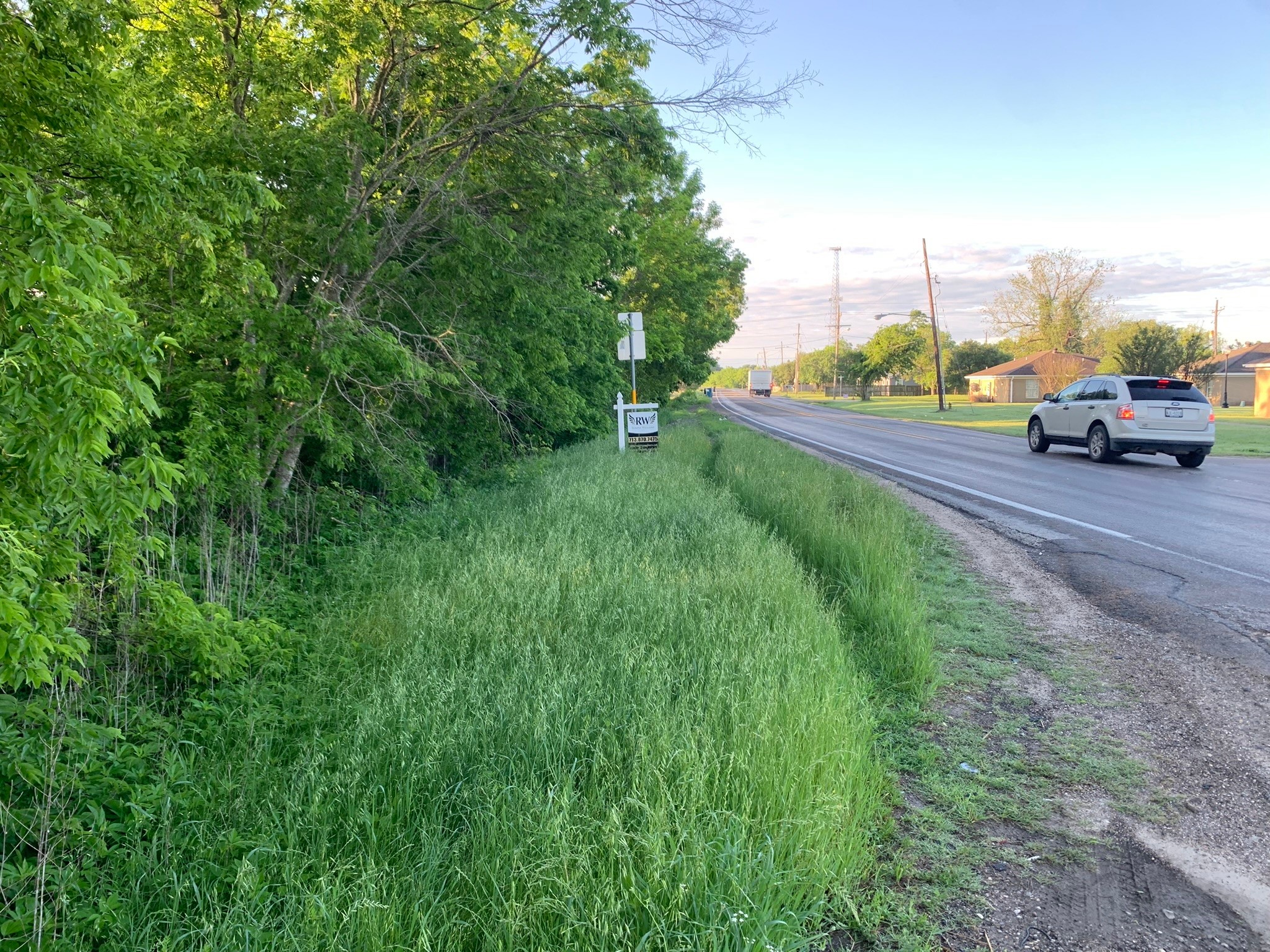501 Fm 1227 Navasota, TX 77868 - Photo 3 of 12 a view of a street with a car parked on the side of the road