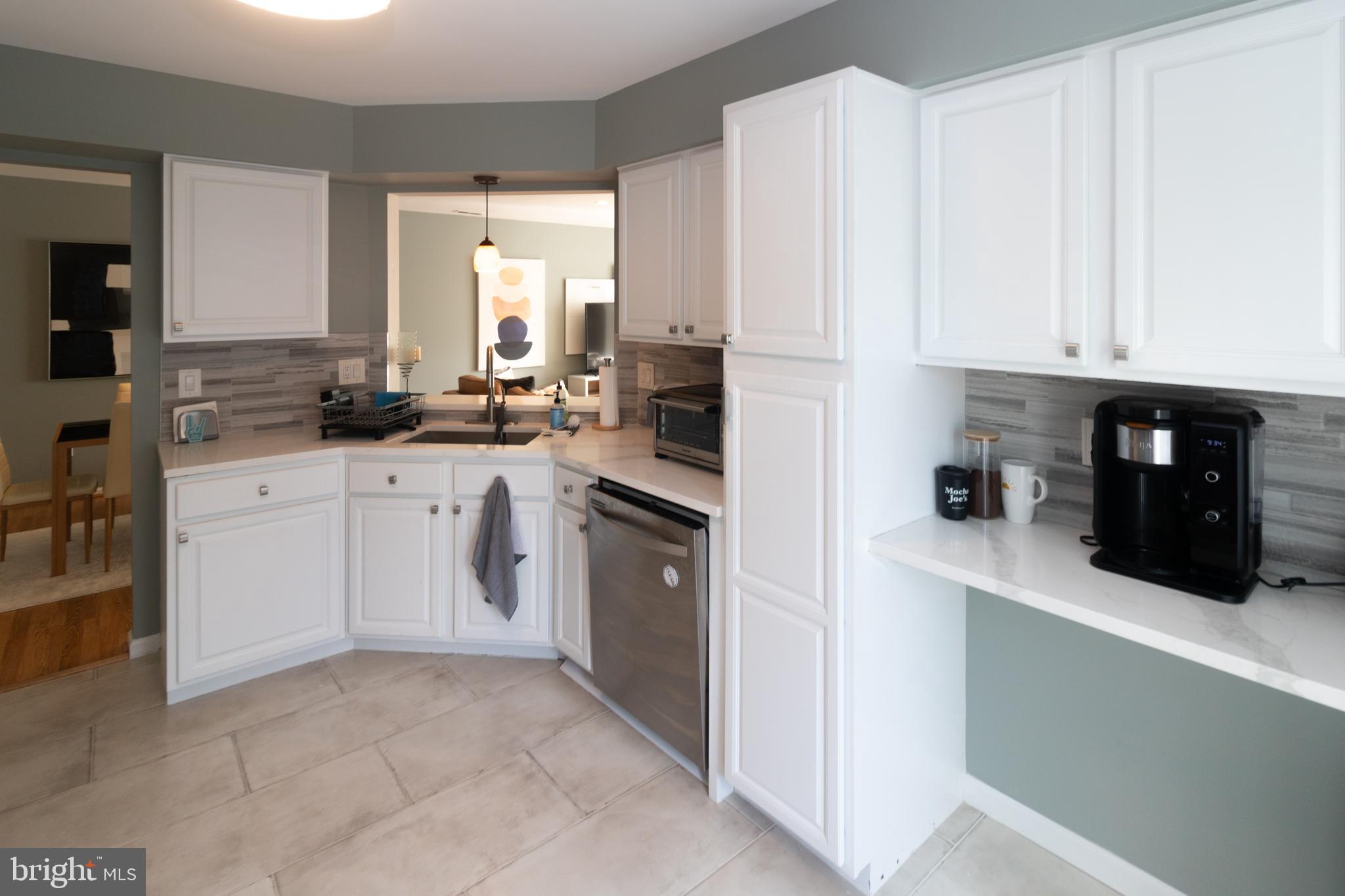 705 Oliphant Lane Mount Laurel, NJ 08054 - Photo 12 of 28 a kitchen with white cabinets and white appliances