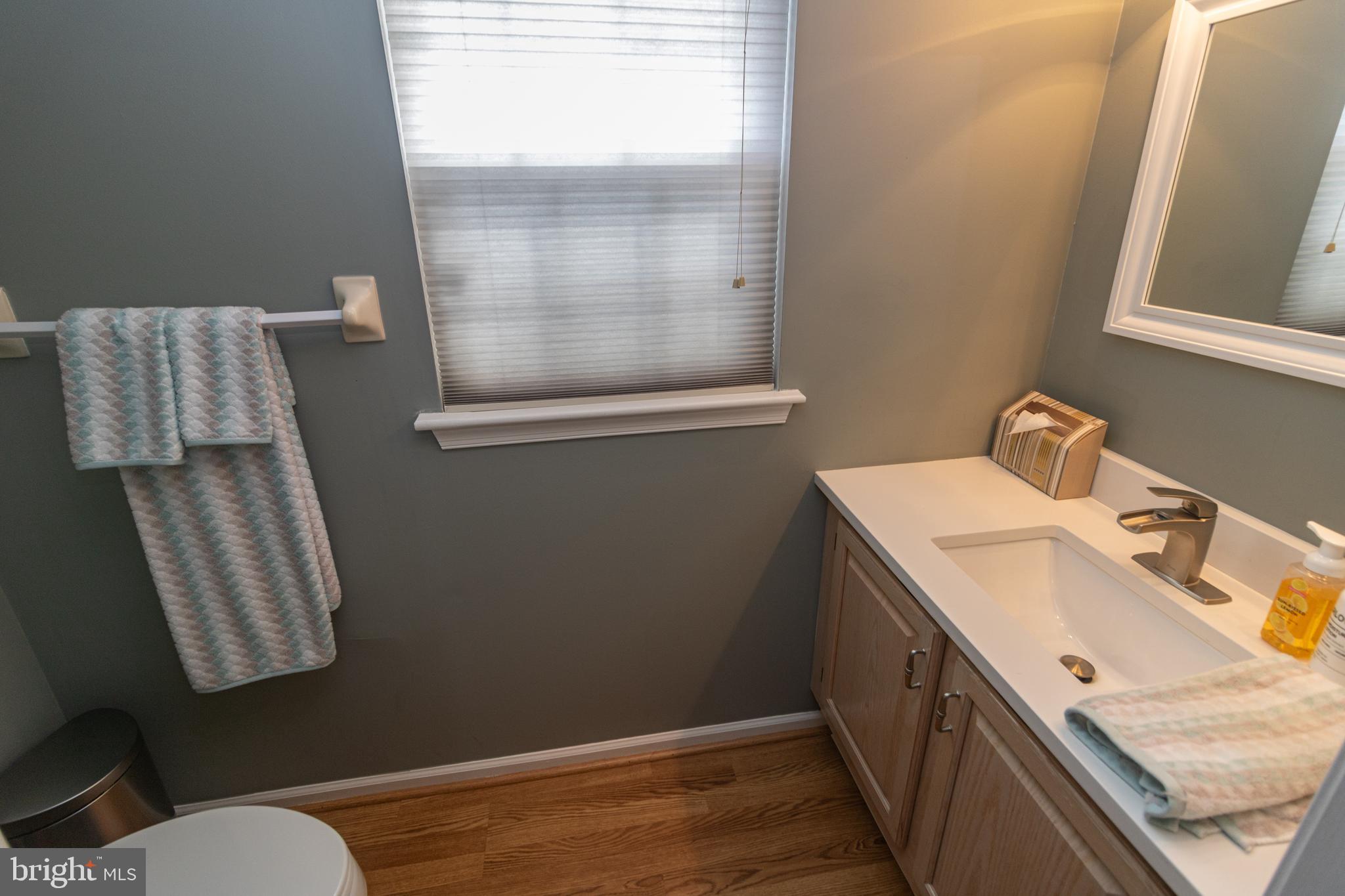 705 Oliphant Lane Mount Laurel, NJ 08054 - Photo 15 of 28 a bathroom with a sink and a mirror