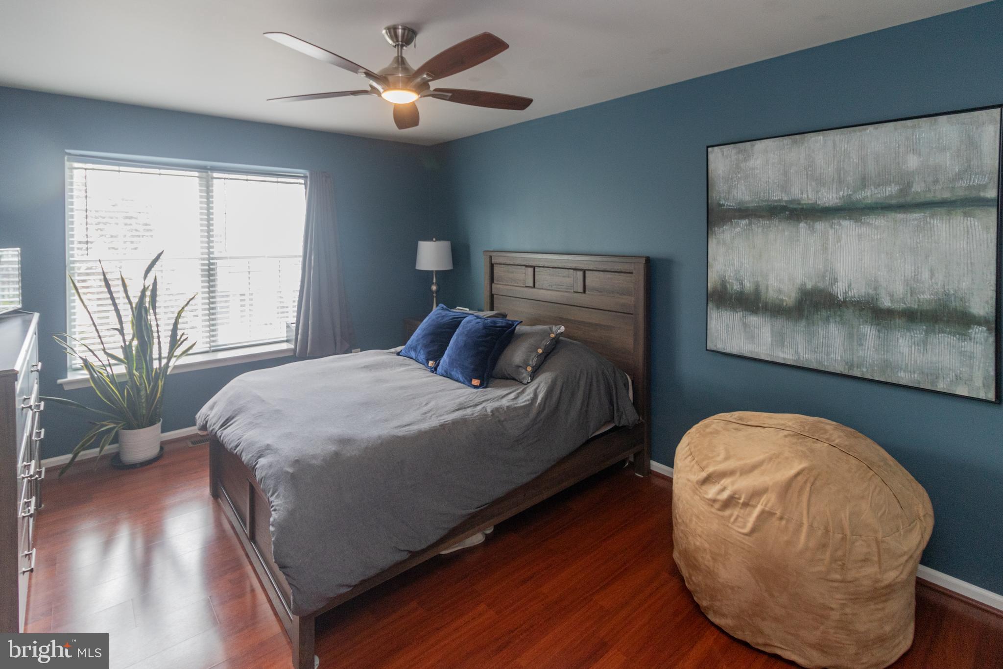 705 Oliphant Lane Mount Laurel, NJ 08054 - Photo 18 of 28 a bedroom with a bed and a chandelier