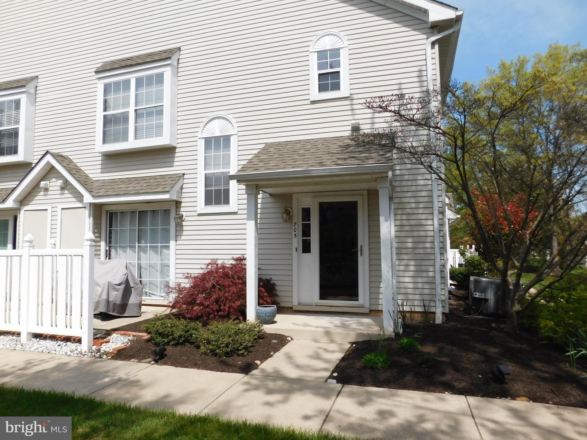705 Oliphant Lane Mount Laurel, NJ 08054 - Photo 2 of 28 a view of a white house with a yard and potted plants