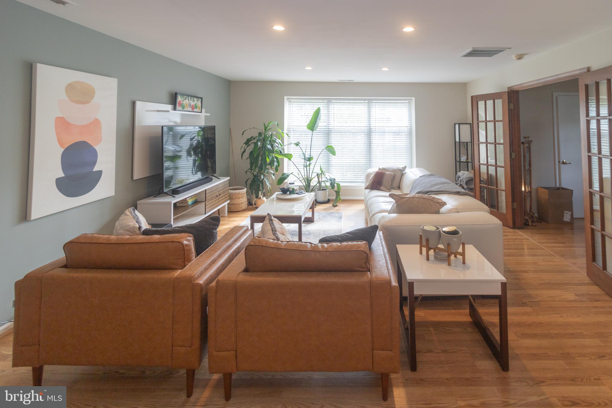 705 Oliphant Lane Mount Laurel, NJ 08054 - Photo 3 of 28 a living room with furniture and a flat screen tv