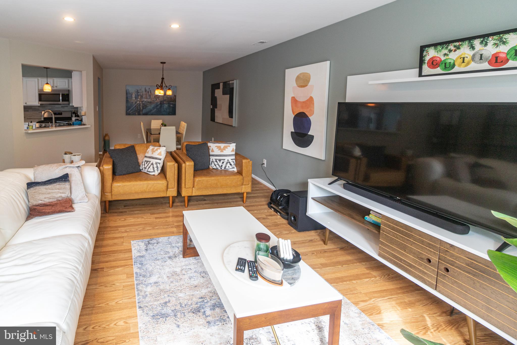 705 Oliphant Lane Mount Laurel, NJ 08054 - Photo 4 of 28 a living room with furniture and a flat screen tv