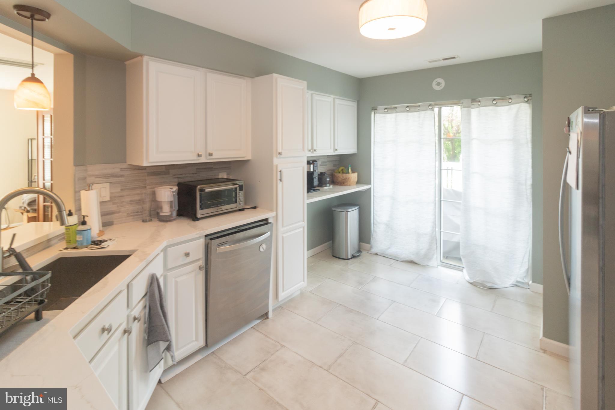 705 Oliphant Lane Mount Laurel, NJ 08054 - Photo 7 of 28 a kitchen with a sink cabinets and appliances