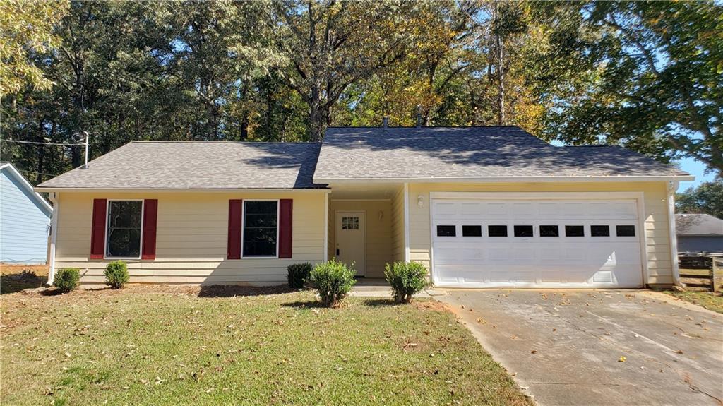 2552 Hewatt Road Snellville, GA 30039 - Photo 1 of 1 a front view of a house with a yard