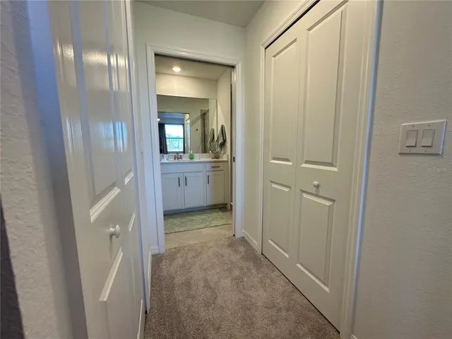 a bathroom with a double vanity sink toilet and shower