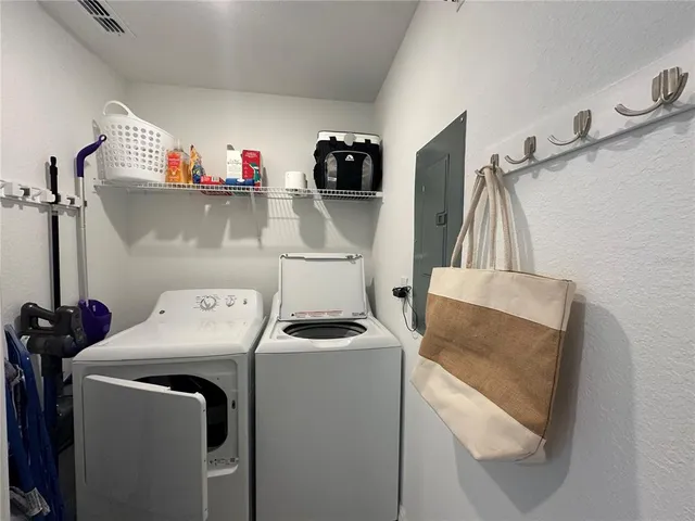 a view of a chair and table in the balcony