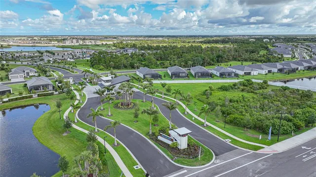 a swimming pool with outdoor seating and yard