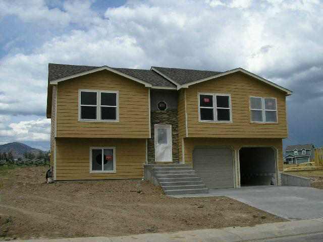 1224 East 18th Way Rifle, CO 81650 - Photo 1 of 1 a front view of a house with garage
