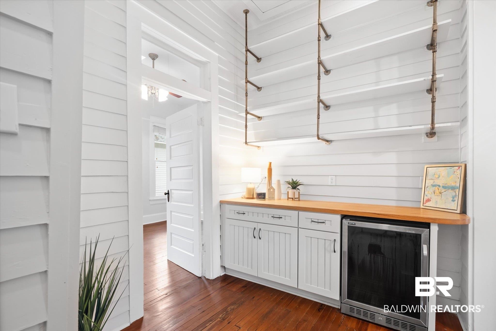 14 South Monterey Street Mobile, AL 36604 - Photo 10 of 41 Bar with wine cooler, wood counters, dark hardwood / wood-style flooring, wood walls, and white cabinets