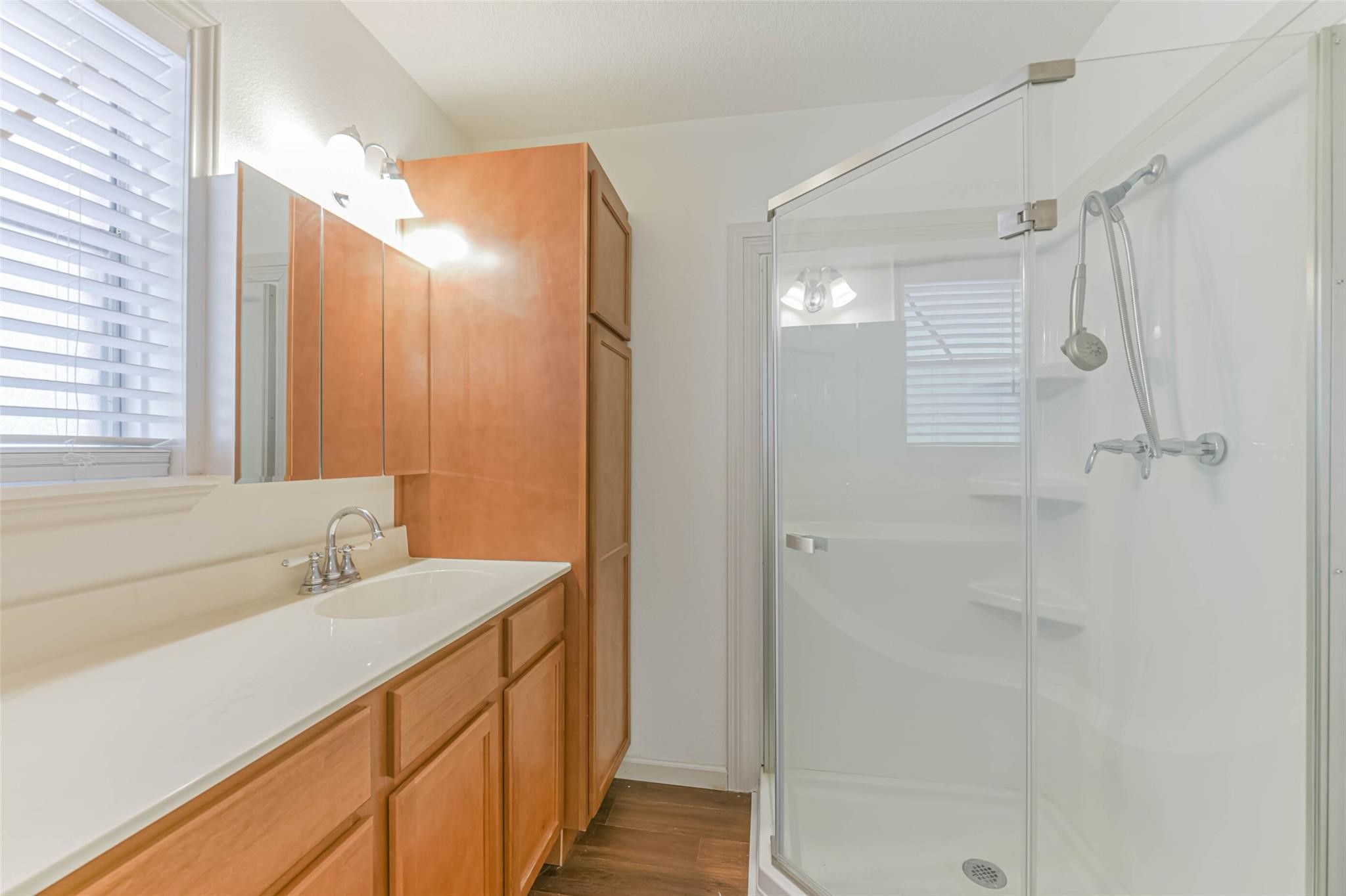 12002 Palmcroft Street Houston, TX 77034 - Photo 11 of 16 a bathroom with a double vanity sink and mirror