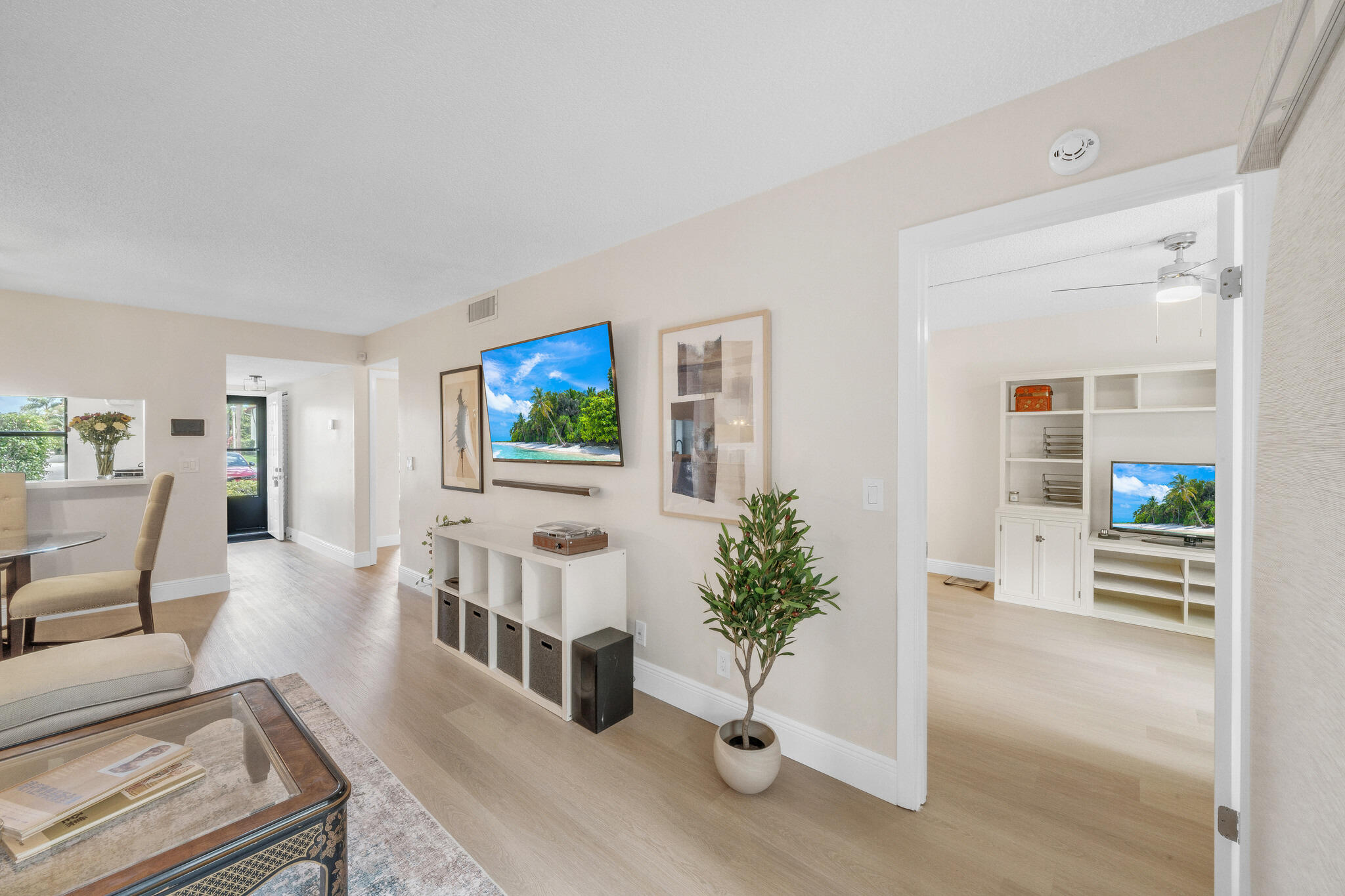 22136 Palms Way, Unit 103 Boca Raton, FL 33433 - Photo 18 of 42 a living room with furniture and flowers