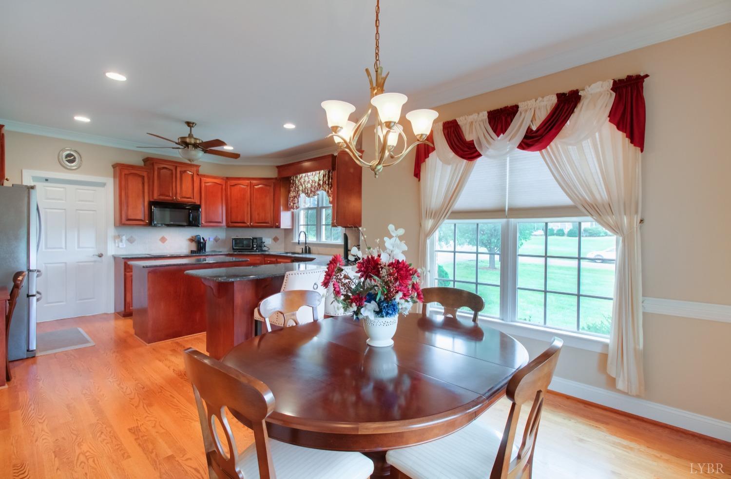 1228 Doyles Run Forest, VA 24551 - Photo 35 of 87 a view of a dining room with furniture a chandelier and wooden floor