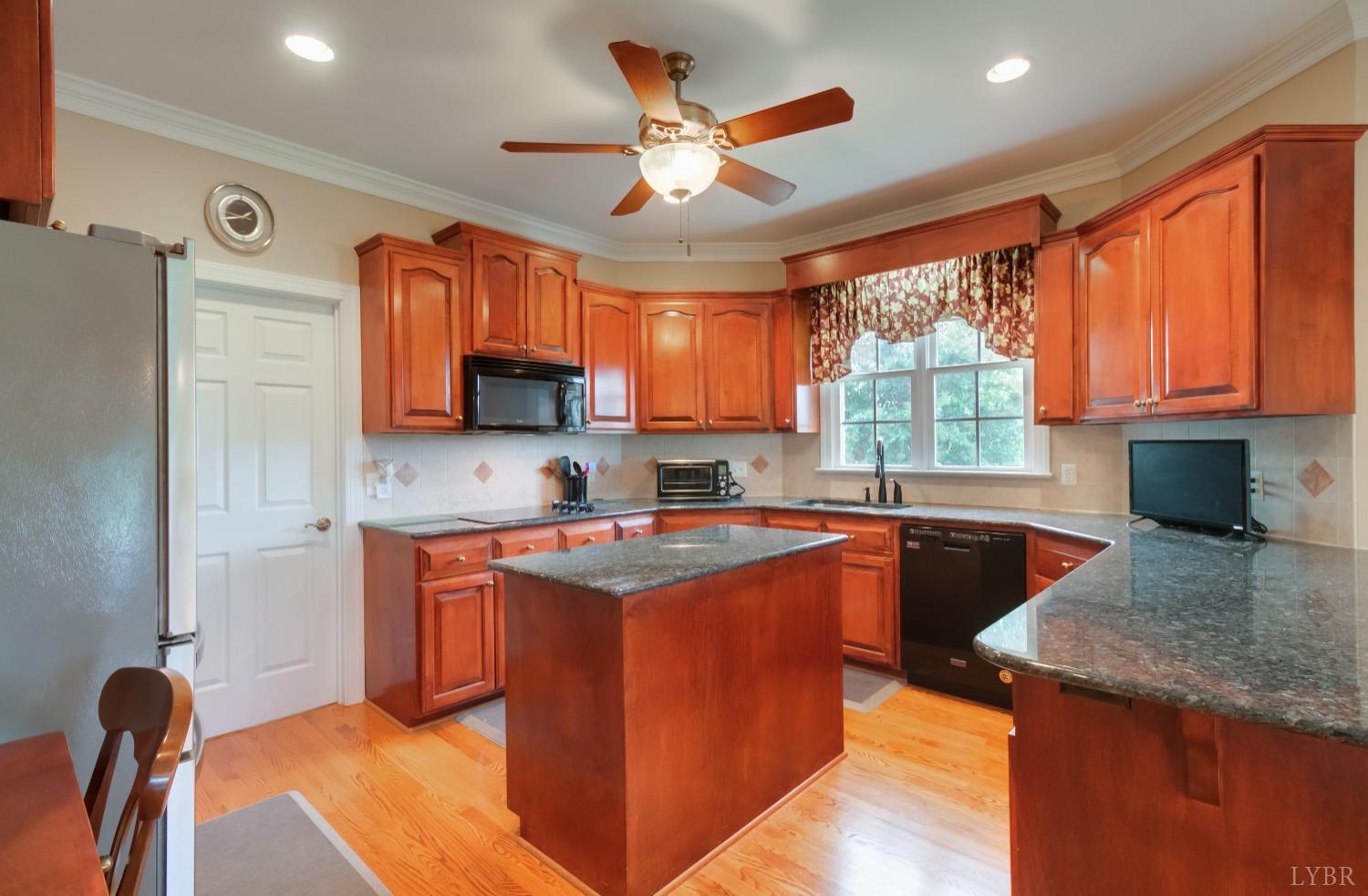 1228 Doyles Run Forest, VA 24551 - Photo 37 of 87 a kitchen with stainless steel appliances granite countertop a sink stove and refrigerator