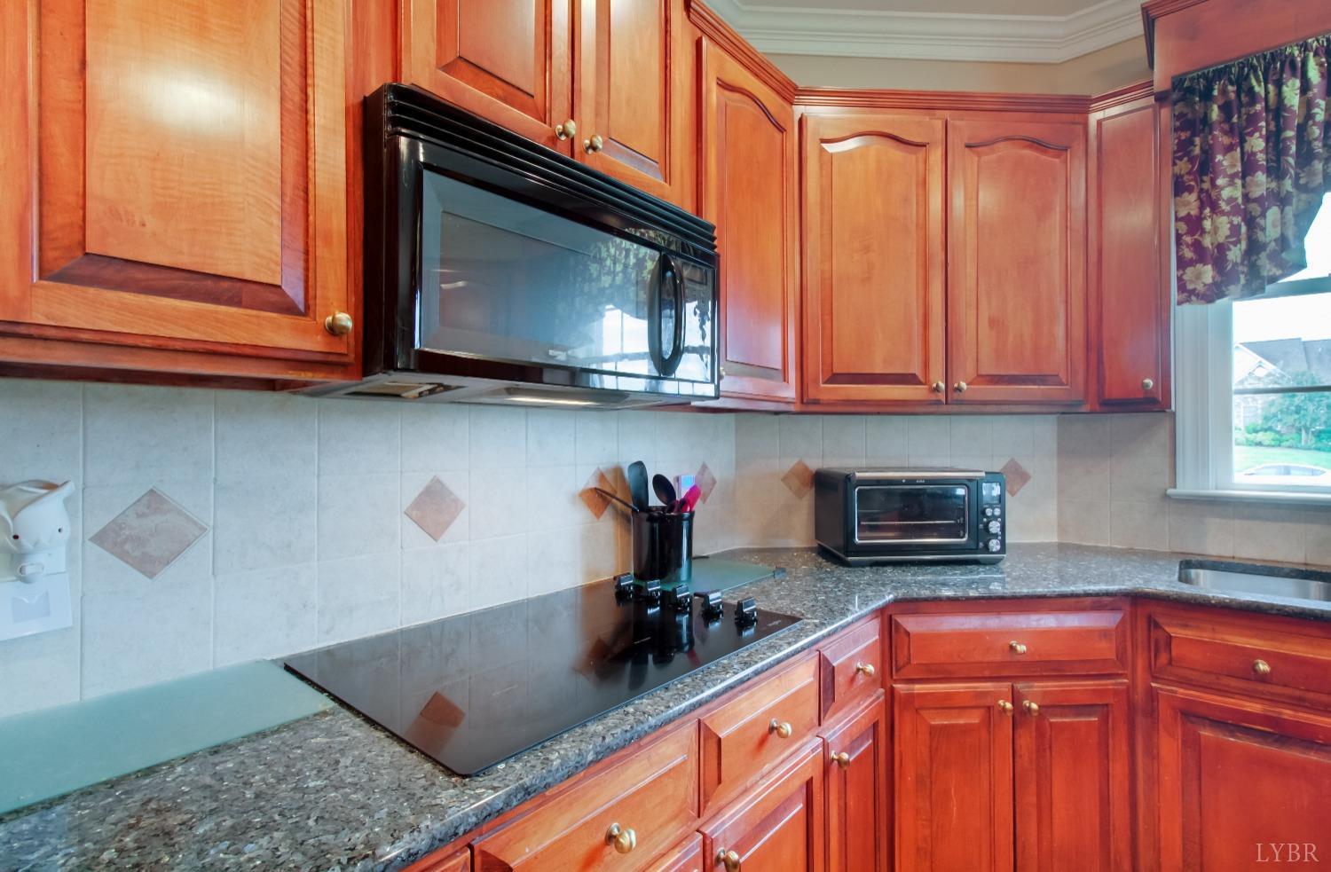 1228 Doyles Run Forest, VA 24551 - Photo 41 of 87 a kitchen with stainless steel appliances granite countertop a sink dishwasher microwave stove and cabinets