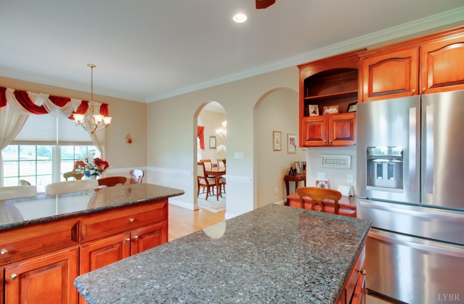 1228 Doyles Run Forest, VA 24551 - Photo 43 of 87 a kitchen with stainless steel appliances granite countertop a refrigerator and a sink