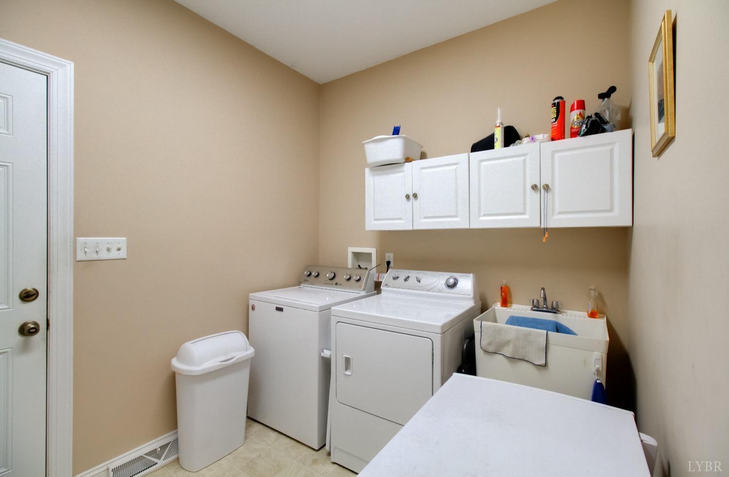 1228 Doyles Run Forest, VA 24551 - Photo 44 of 87 a utility room with dryer washer and a sink