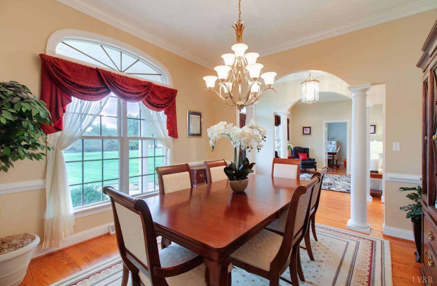 1228 Doyles Run Forest, VA 24551 - Photo 50 of 87 a view of a dining room with furniture a chandelier and wooden floor