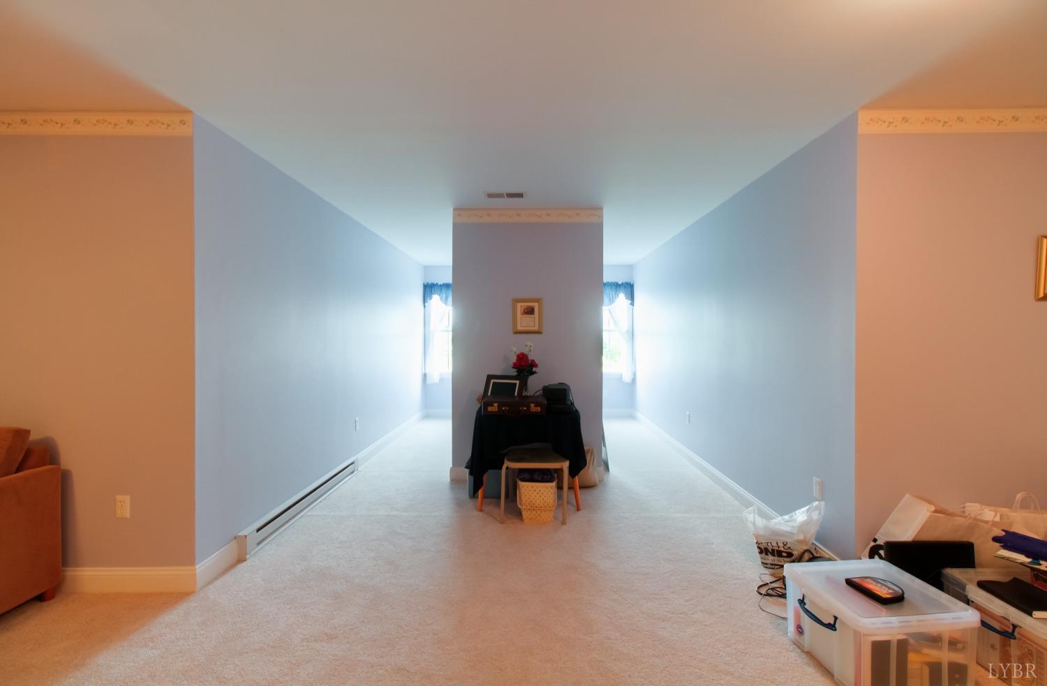 1228 Doyles Run Forest, VA 24551 - Photo 57 of 87 a man sitting on a bench in a room