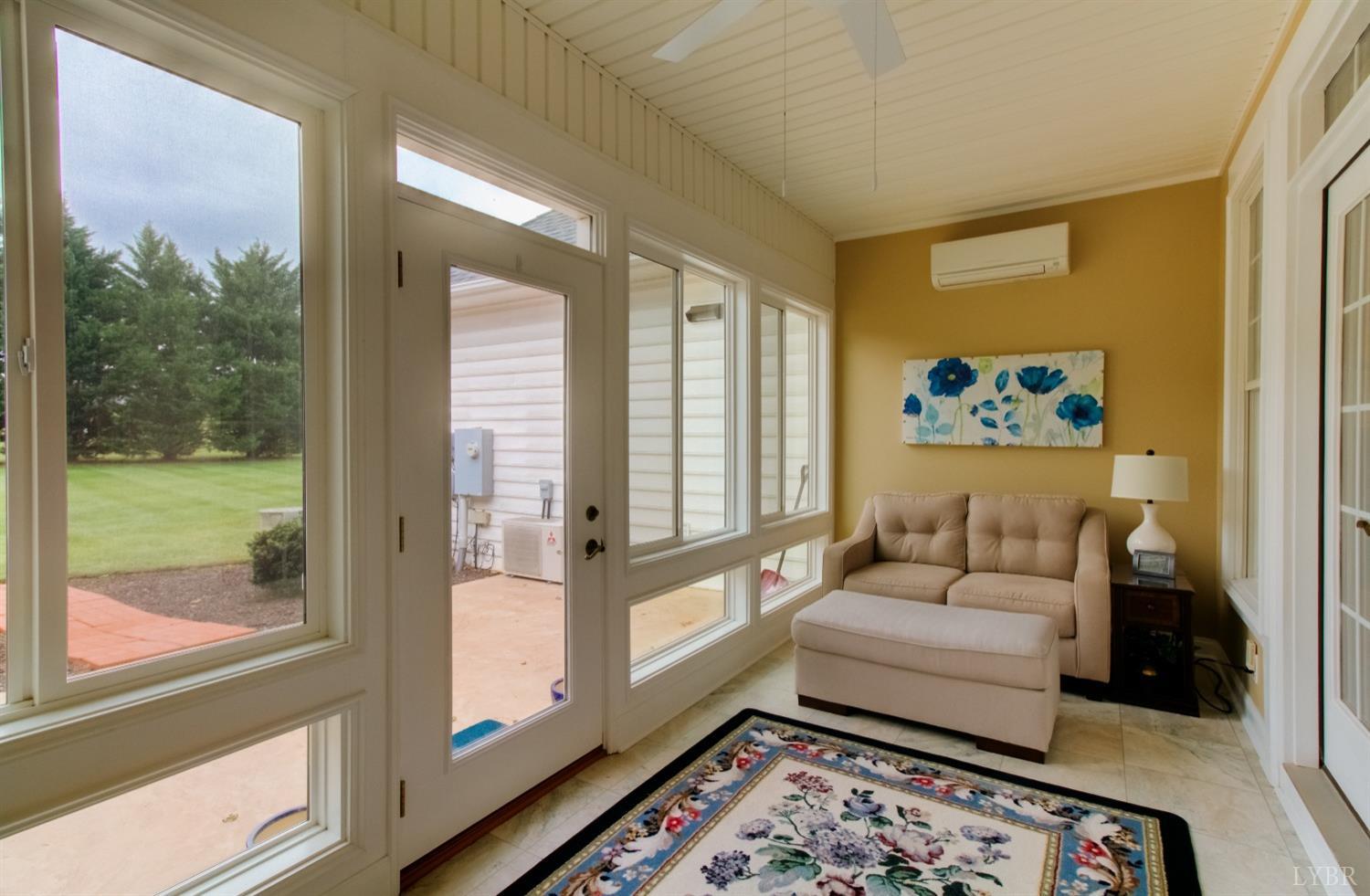 1228 Doyles Run Forest, VA 24551 - Photo 63 of 87 a living room with furniture and a floor to ceiling window