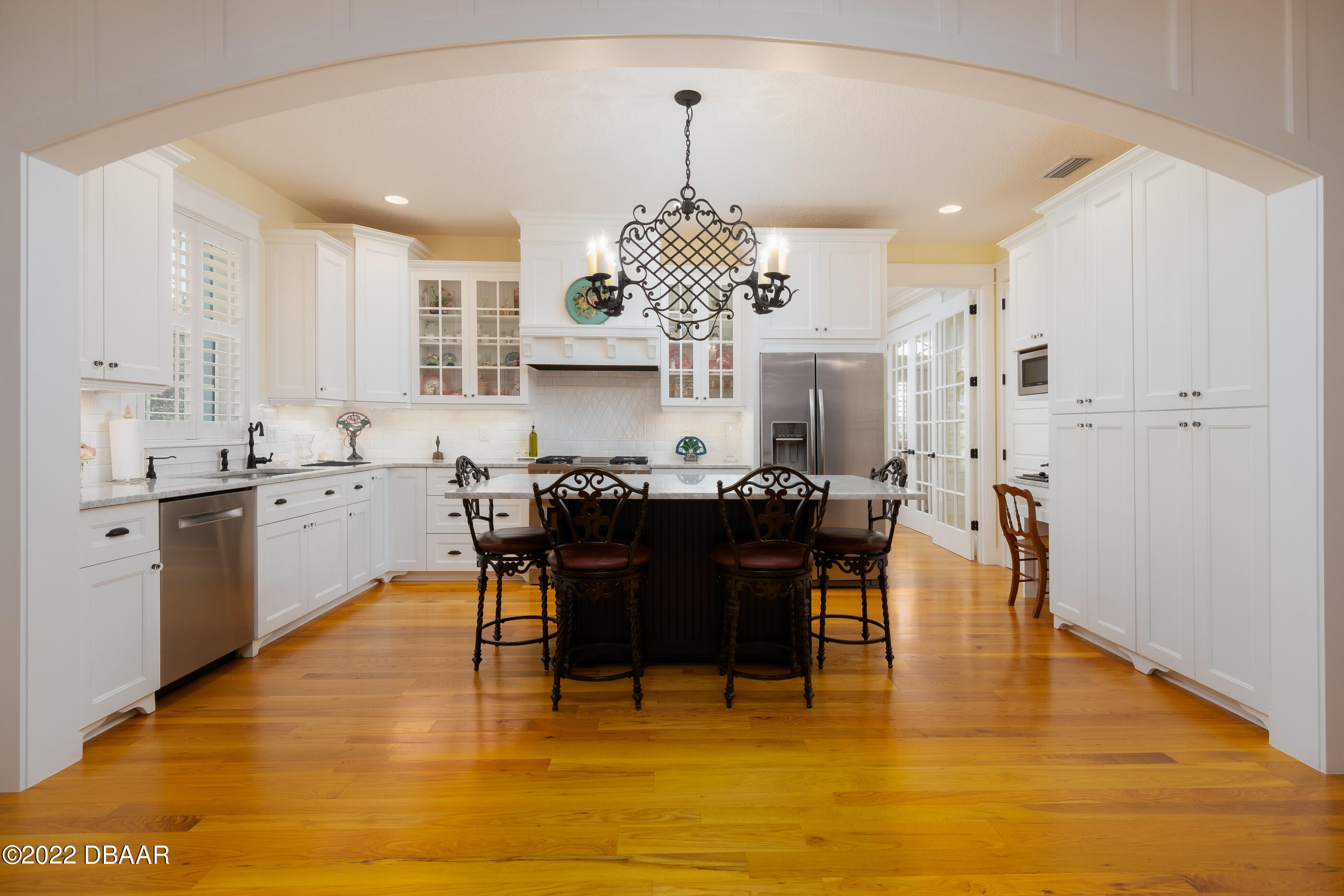 1212 South Riverside Drive New Smyrna Beach, FL 32168 - Photo 14 of 49 a large kitchen with a table and chairs