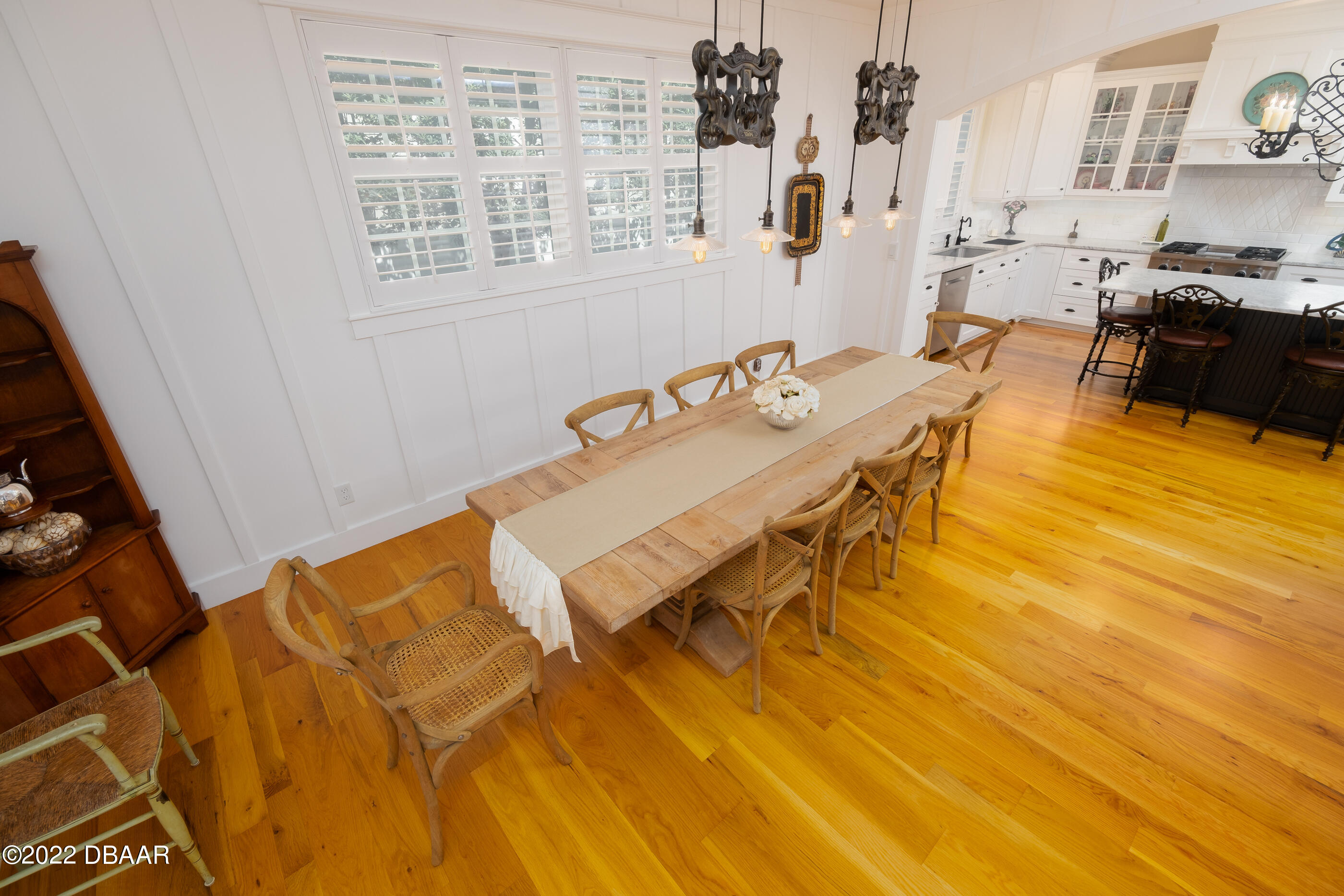 1212 South Riverside Drive New Smyrna Beach, FL 32168 - Photo 20 of 49 a dining room with a table and chairs