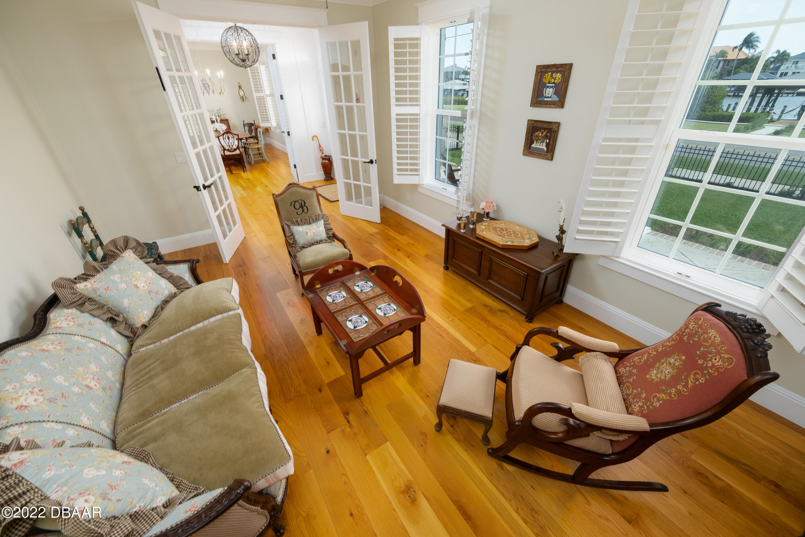 1212 South Riverside Drive New Smyrna Beach, FL 32168 - Photo 22 of 49 a living room with furniture and a floor to ceiling window