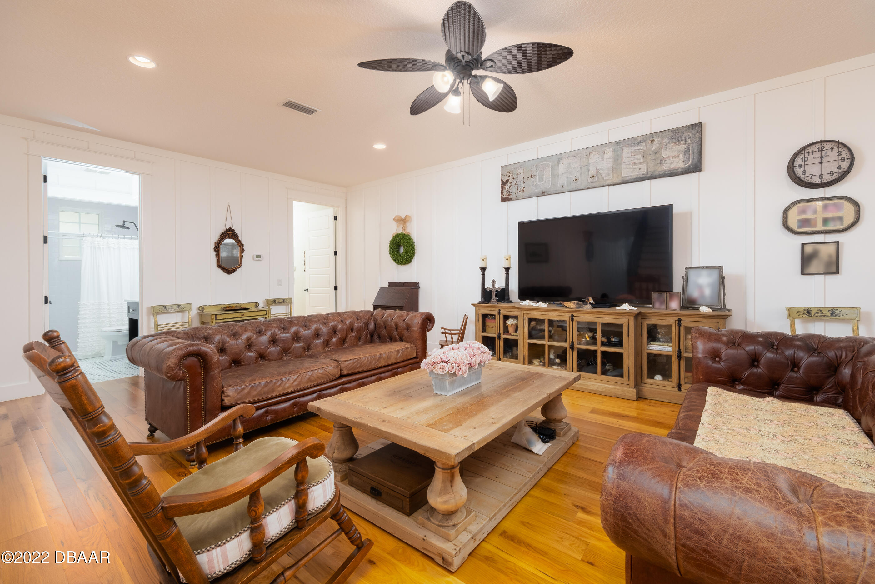 1212 South Riverside Drive New Smyrna Beach, FL 32168 - Photo 23 of 49 a living room with furniture and a flat screen tv