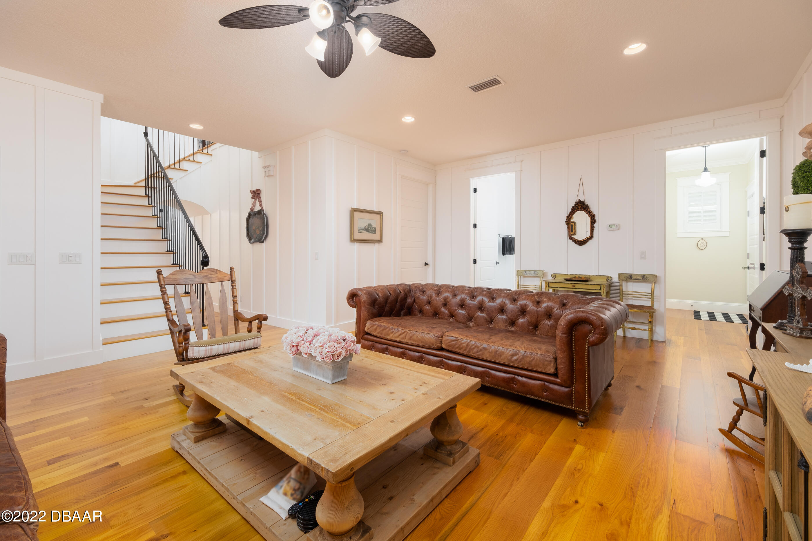 1212 South Riverside Drive New Smyrna Beach, FL 32168 - Photo 24 of 49 a living room with furniture and a wooden floor