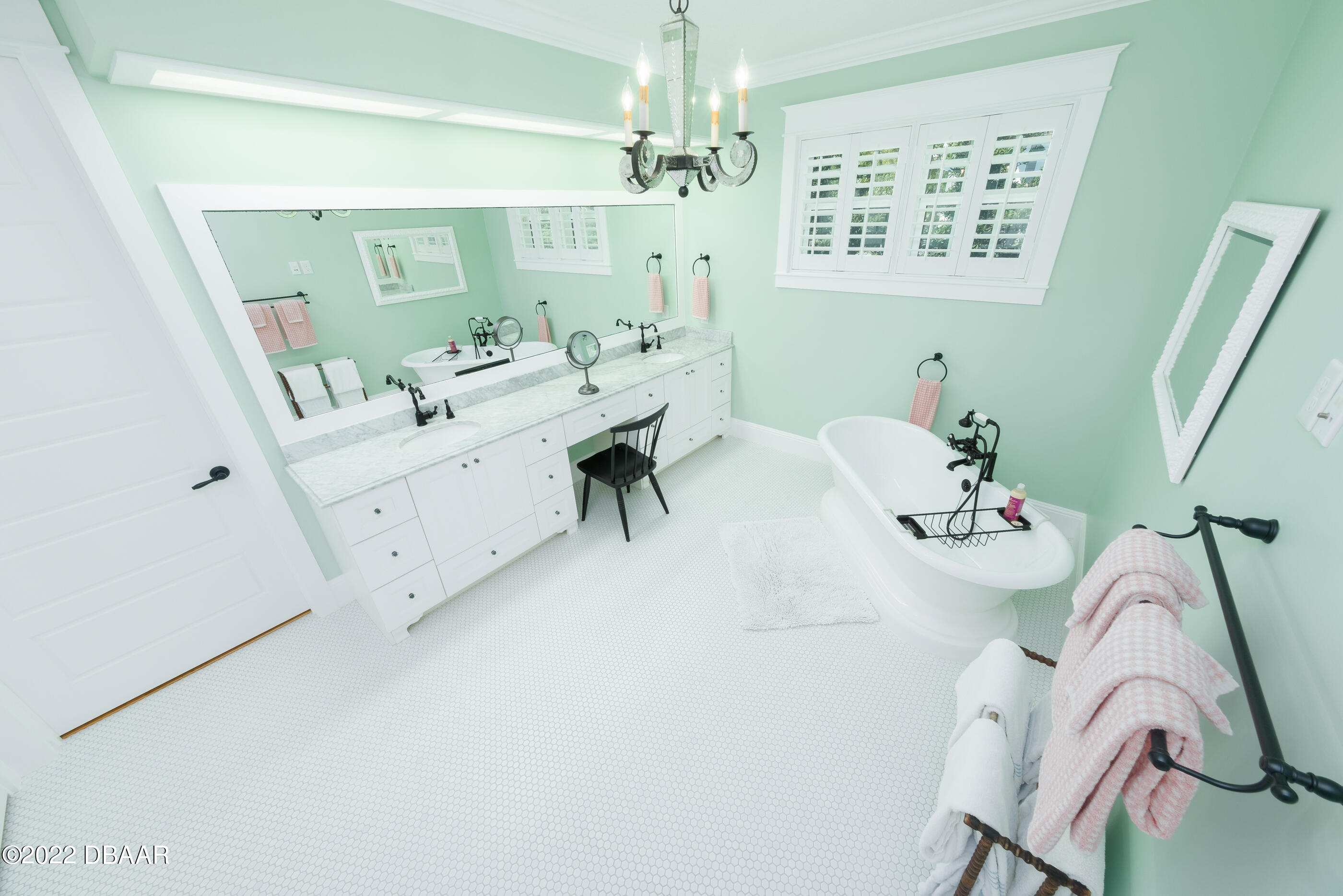 1212 South Riverside Drive New Smyrna Beach, FL 32168 - Photo 28 of 49 a view of living room with furniture and a chandelier