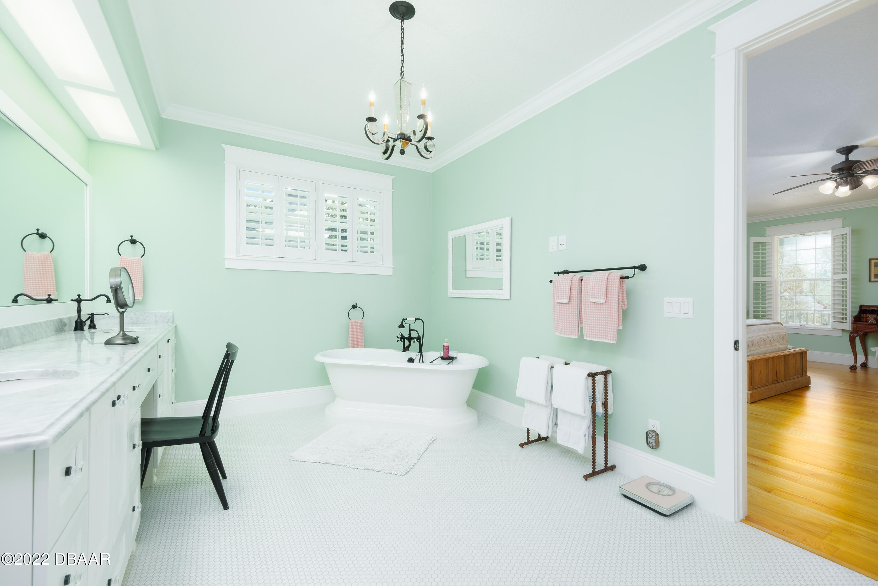1212 South Riverside Drive New Smyrna Beach, FL 32168 - Photo 29 of 49 a view of a dining room with furniture and a chandelier
