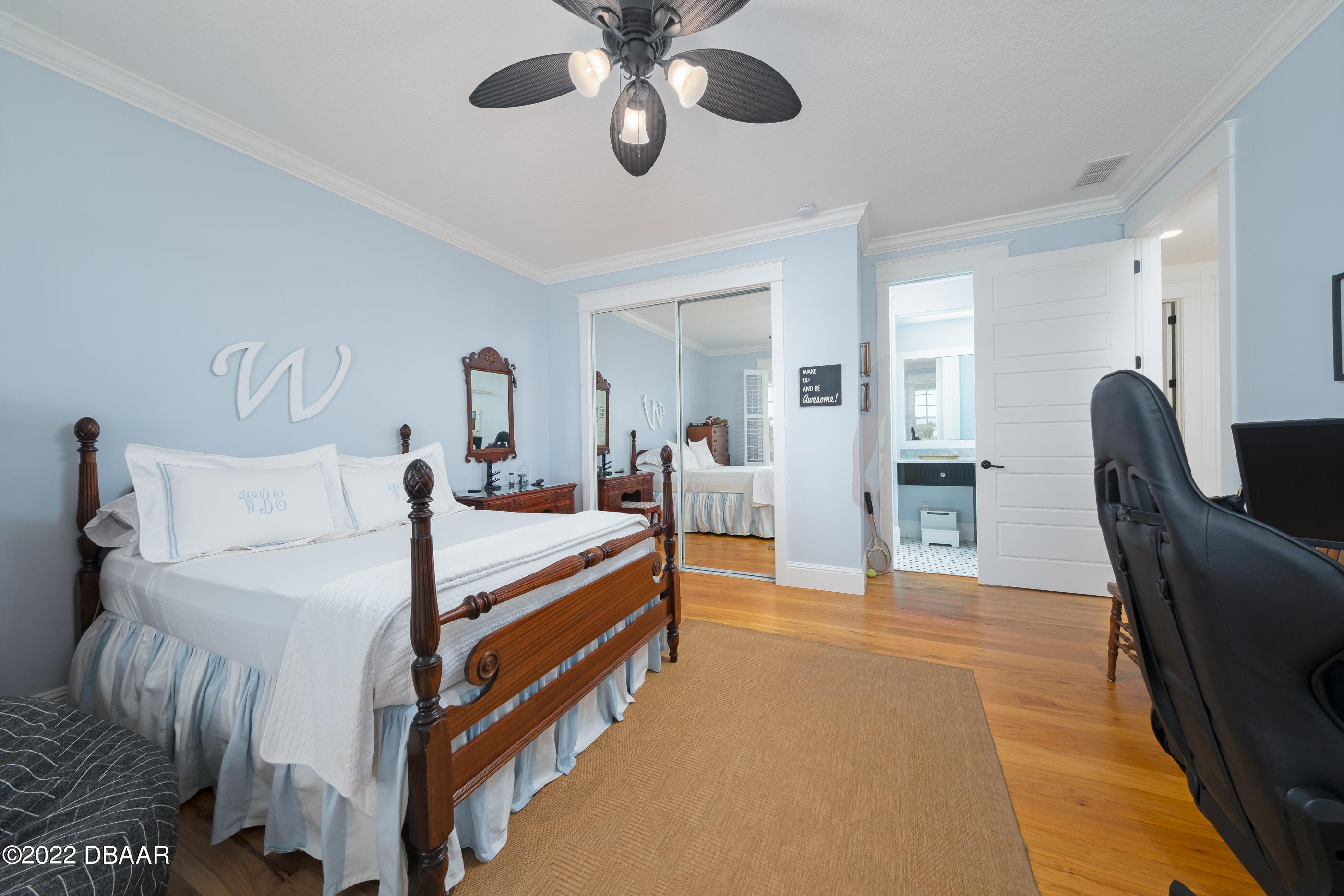 1212 South Riverside Drive New Smyrna Beach, FL 32168 - Photo 31 of 49 a bedroom with a bed couch and a chandelier