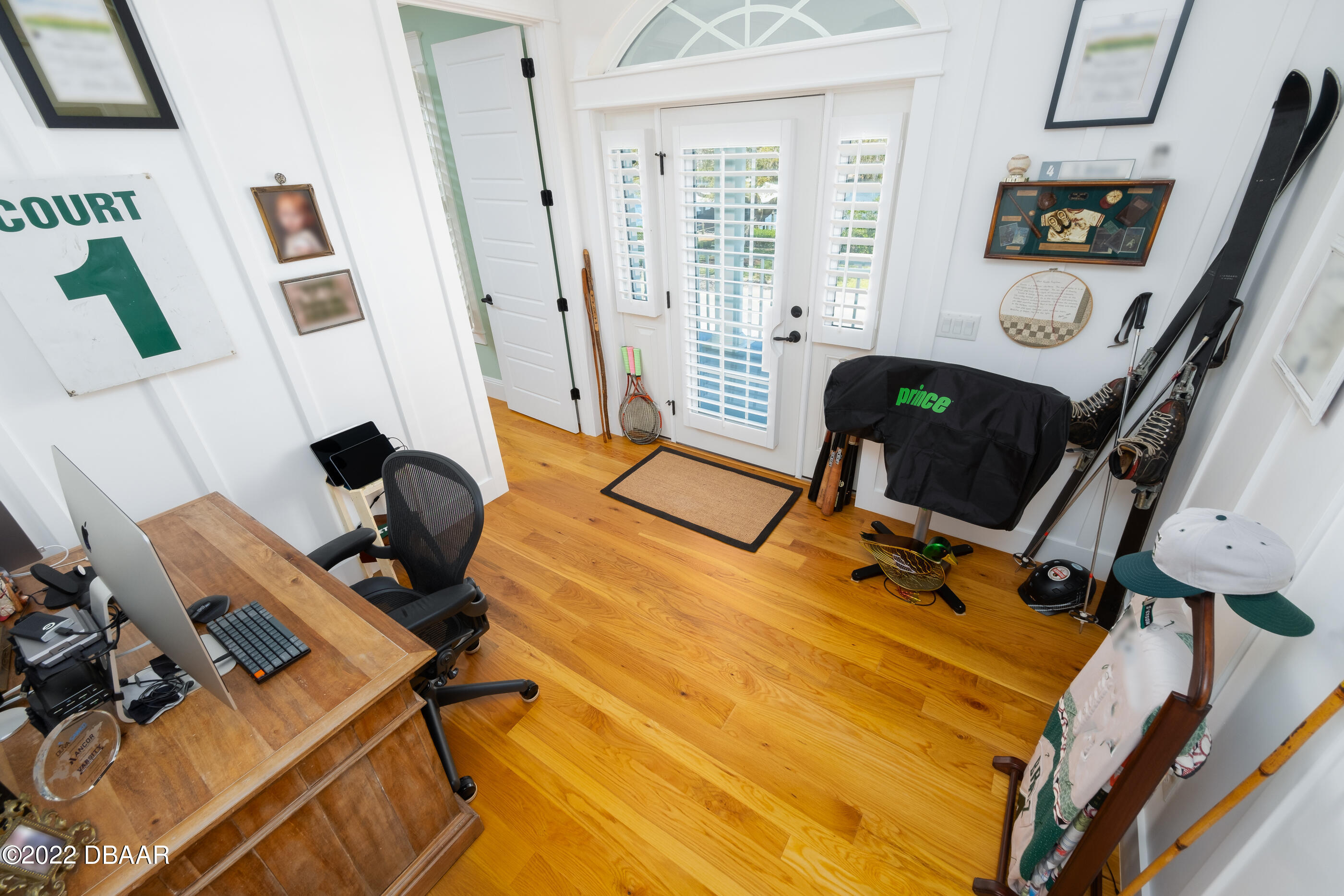 1212 South Riverside Drive New Smyrna Beach, FL 32168 - Photo 37 of 49 a view of a workspace with furniture and a window