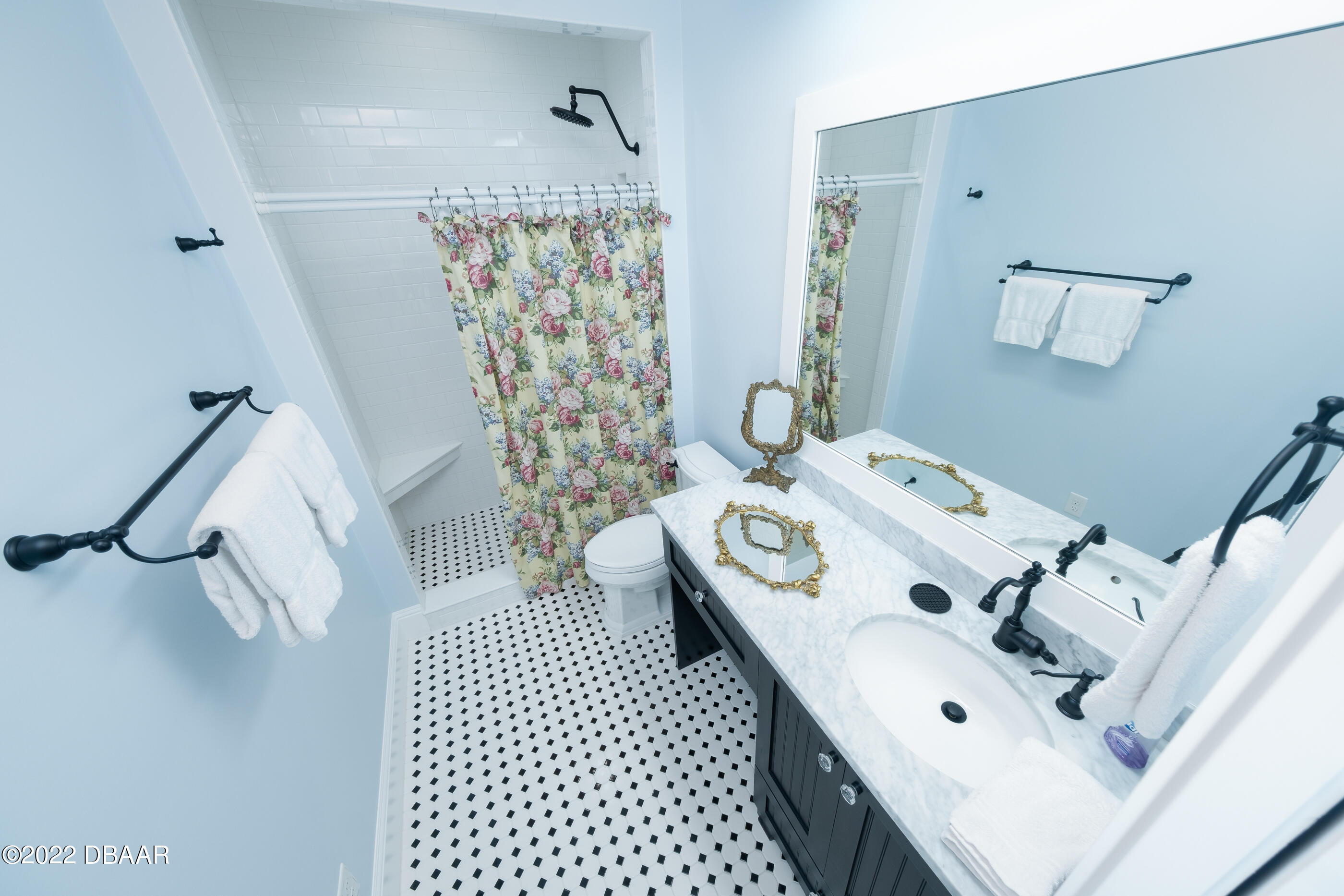 1212 South Riverside Drive New Smyrna Beach, FL 32168 - Photo 41 of 49 a bedroom with a bed and a white cabinet