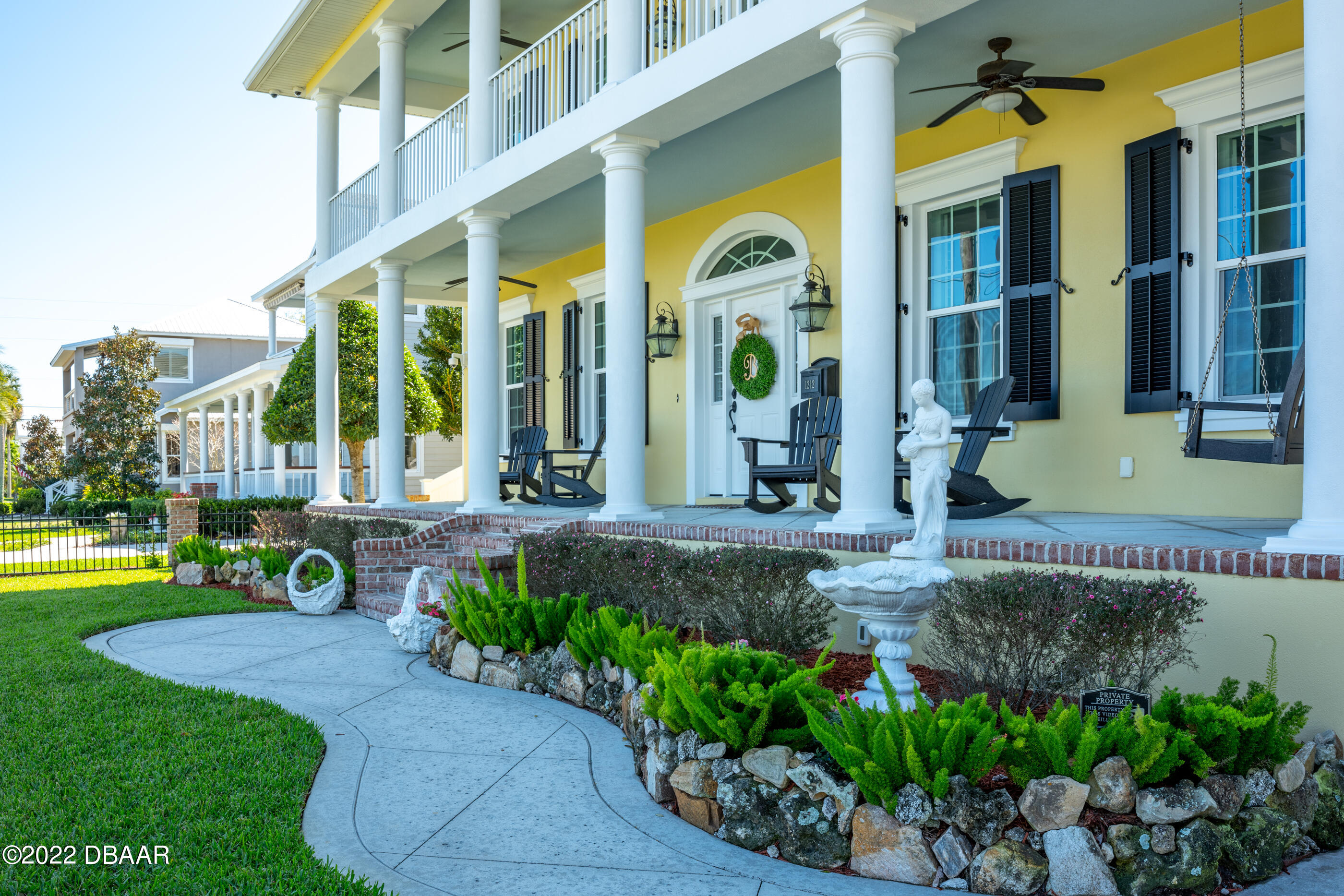 1212 South Riverside Drive New Smyrna Beach, FL 32168 - Photo 49 of 49 a view of a building with a garden