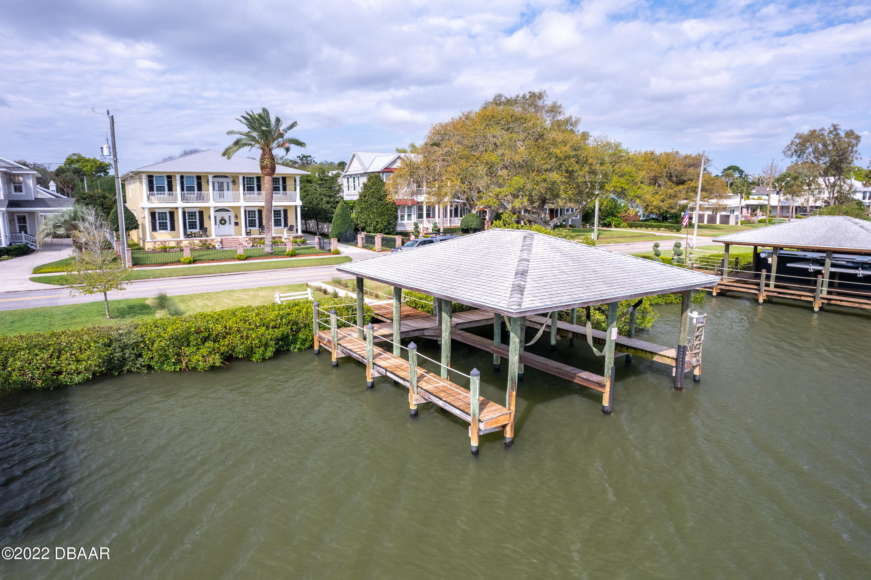 1212 South Riverside Drive New Smyrna Beach, FL 32168 - Photo 6 of 49 an outdoor sitting area with couch and entertaining space