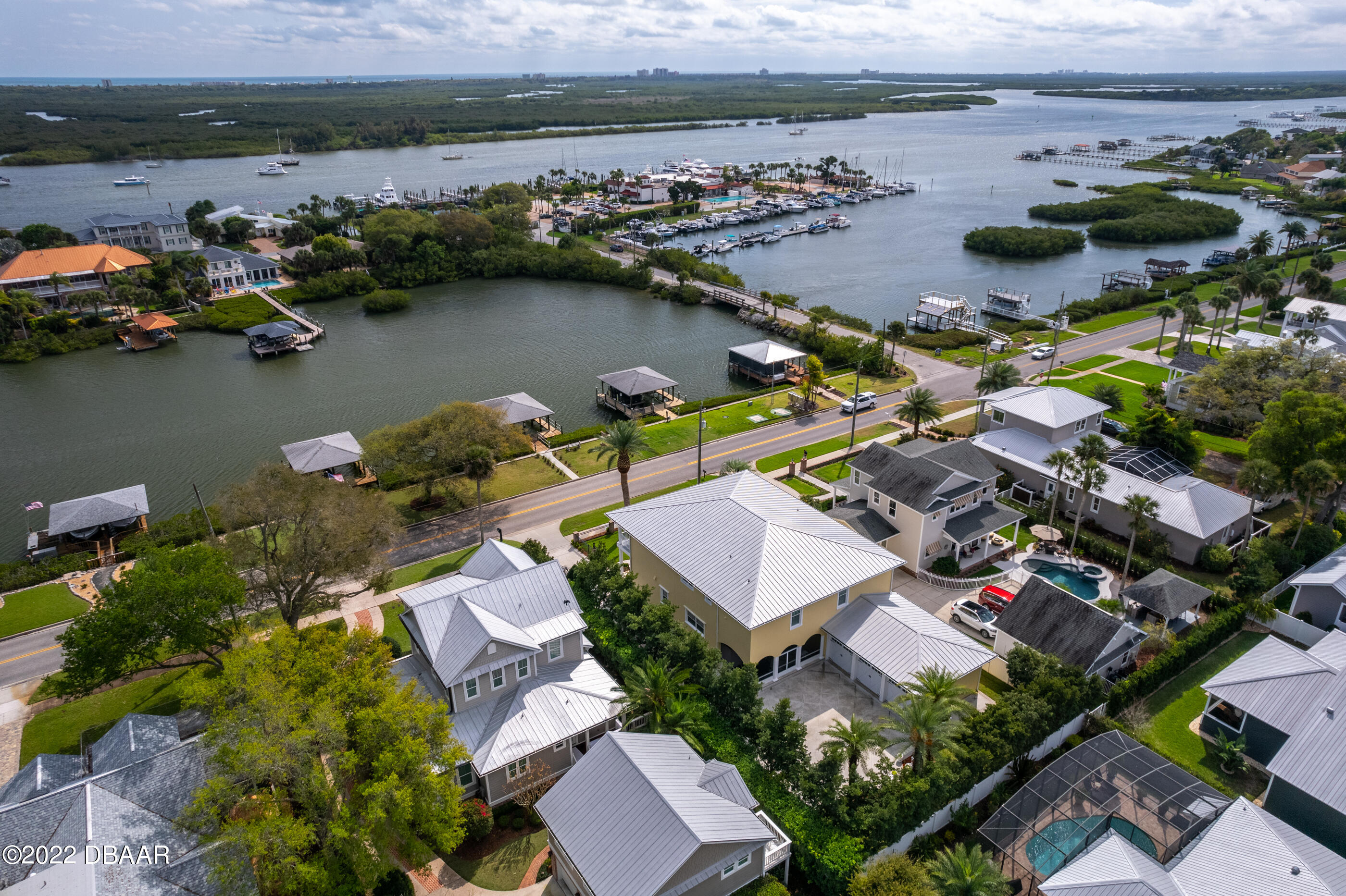 1212 South Riverside Drive New Smyrna Beach, FL 32168 - Photo 9 of 49 an aerial view of a house with a lake view