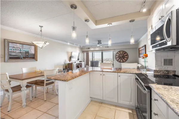 a kitchen with stainless steel appliances granite countertop a sink and cabinets